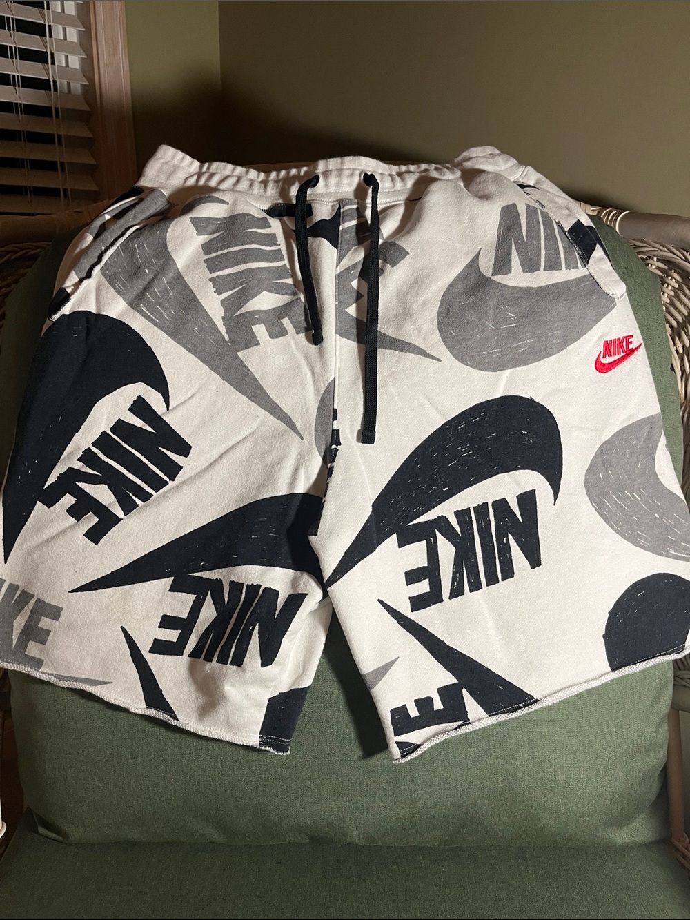Nike Men’s White Shorts with Black Logo Print and Red Swoosh